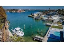 Waterfront home featuring a private dock, boat lift, and easy access to the open bay at 629 59Th Ave, St Pete Beach, FL 33706