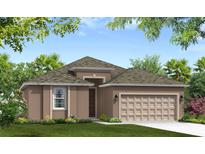 Charming single-story home featuring a two-car garage and nicely landscaped front yard at 12631 Kelly Ann Loop, Brooksville, FL 34613