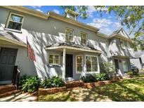 Charming two-story home with gray stucco and well-maintained landscaping at 2515 S Ysabella Ave, Tampa, FL 33629