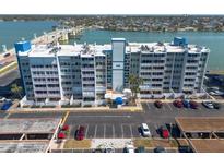 Multi-story condo building with bay views, ample parking, and well-maintained landscaping at 500 Treasure Island Cswy # 402, Treasure Island, FL 33706