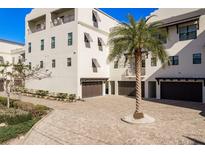 Charming townhouse with multiple garages and lush landscaping in a waterfront community at 188 Brightwater Dr # 2, Clearwater Beach, FL 33767