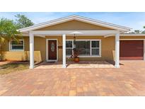 Charming home featuring a covered front porch and beautiful brick paved driveway at 4581 21St N Ave, St Petersburg, FL 33713
