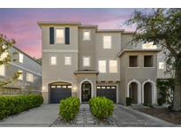Charming townhome featuring a well-manicured lawn, attached garage, and welcoming front entrance, perfect for comfortable living at 520 Wheaton Trent Pl, Tampa, FL 33619