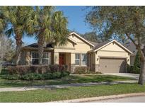 Charming single-story home with a well-maintained lawn and inviting front entrance at 15740 Starling Water Dr, Lithia, FL 33547