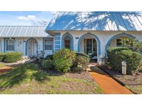 Charming villa featuring a well-maintained lawn and blue trim accents at 4222 Richmere Dr # 4222, New Port Richey, FL 34652