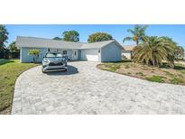 Charming home with a well-manicured lawn, a paved driveway and a one car garage at 4662 Dewey Dr, New Port Richey, FL 34652