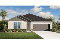 Charming single-story home boasts a manicured lawn, inviting entryway, and a convenient attached two-car garage at 5588 Delight Ave, North Port, FL 34288