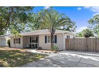 Charming single-story home featuring a well-maintained front yard, a mature palm tree, and a convenient driveway at 917 2Nd Nw Ave, Largo, FL 33770