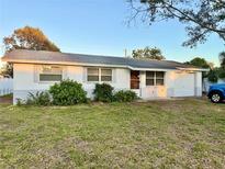 Charming single-story home with well-maintained landscaping and attached garage at 1620 Valencia E Dr, Largo, FL 33778