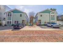 Charming two-story townhouse with two parking spaces and brick paved street at 632 Charles S Ct, St Petersburg, FL 33701