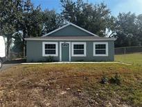 Cozy single-story home with a well-manicured front yard and chain link fence at 8421 N 39Th St, Tampa, FL 33604