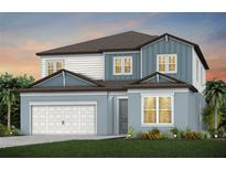 Charming two-story home with a two-car garage, a mix of siding, and meticulously manicured landscaping at 37244 Clinch Cir, Zephyrhills, FL 33540
