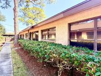 Charming exterior view of a well-maintained home with manicured landscaping and a sidewalk at 5603 Sycamore N St # 5603, St Petersburg, FL 33703