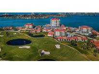 Stunning aerial view of community with golf course, water, and residential buildings at 6210 Sun Blvd # 408, St Petersburg, FL 33715