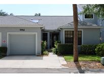 Charming single-story home featuring a one car garage, well maintained lawn and beautiful front door at 992 San Carlos Ne Ct, St Petersburg, FL 33702