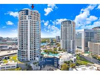 Beautiful condo building featuring a resort-style pool and views of the water and downtown at 1209 E Cumberland Ave # 1703, Tampa, FL 33602