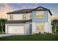 Charming two-story home with a two car garage and beautifully landscaped front yard at 37252 Clinch Cir, Zephyrhills, FL 33540
