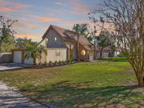 Charming home with a lush lawn, well-maintained landscaping, and an attached garage at 404 Craft Rd, Brandon, FL 33511