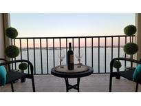 Inviting balcony with comfortable seating offers serene water views, perfect for relaxation and enjoying sunsets at 7700 Sun Island S Dr # 608, South Pasadena, FL 33707