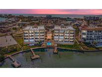 Beautiful waterfront condo buildings with a community pool and dock access to the ocean at 240 108Th Ave # 102, Treasure Island, FL 33706