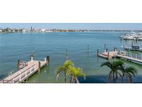Scenic waterfront view featuring docks and boats under a bright blue sky at 240 108Th Ave # 102, Treasure Island, FL 33706