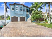 Lovely two-story home featuring a two-car garage, and a brick driveway at 541 Treviso Dr, Apollo Beach, FL 33572