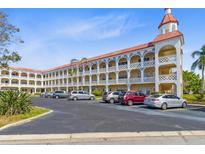 Beautiful condo with a light colored exterior, rows of balconies and ample parking at 2404 Florentine Way # 40, Clearwater, FL 33763