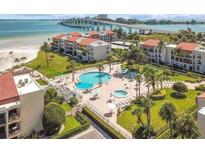 Beautiful aerial view of condos, pool, beach, and oceanfront near the bridge at 851 Bayway Blvd # 904, Clearwater Beach, FL 33767