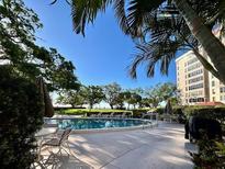 Enjoy the day at the pool overlooking the water at this condominium at 2405 S Ardson Pl # 303A, Tampa, FL 33629