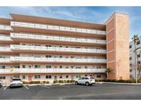 Multi-story building featuring balconies and dedicated parking, offering convenient condo living at 6025 Shore S Blvd # 410, Gulfport, FL 33707