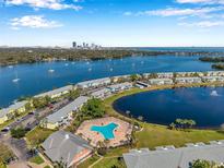 An aerial view overlooking the community, pool, and waterfront at 108 Pompano Se Dr # A, St Petersburg, FL 33705