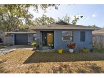 Charming single-story home featuring a cozy front porch and an attached two-car garage at 2332 Seward Dr, Sarasota, FL 34234
