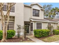 Charming townhome exterior with well-maintained landscaping and neutral color palette at 5100 Burchette Rd # 1606, Tampa, FL 33647