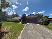 Charming single-Gathering home with lush landscaping and a private driveway at 5101 Estates Cir, Sarasota, FL 34243