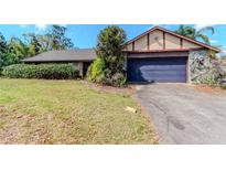 Cozy one story home with a two-car garage and mature landscaping at 5101 Estates Cir, Sarasota, FL 34243
