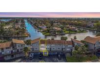 Waterfront townhomes offering stunning canal views and private garages at 6317 Newtown Cir # 17B2, Tampa, FL 33615