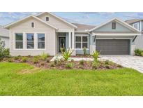 Beautiful home with a well-manicured lawn and appealing landscaping at 31430 Hayman Loop, Wesley Chapel, FL 33545