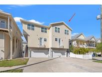 A charming, multi-level house with a two-car garage, balcony, and well-maintained landscaping, perfect for comfortable living at 4859 W Prescott St, Tampa, FL 33616