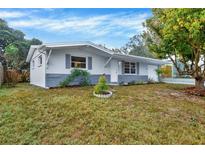 Charming single-story home featuring a well-maintained lawn and welcoming front entrance at 5200 Dove Dr, New Port Richey, FL 34652
