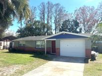 Charming single-Gathering home with a well-maintained lawn and a two-car garage at 6926 Echo Lake Dr, New Port Richey, FL 34653