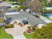 Lovely home with a lush landscaped yard and a circular driveway leading to a charming entrance at 8518 Delaware Dr, Weeki Wachee, FL 34607