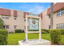 Exterior view of the Long Bayou Building 7 community sign and well-maintained landscaping at 10038 62Nd N Ter # 1, St Petersburg, FL 33708