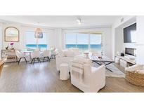 Bright, open living space with stunning ocean views and stylish, modern furnishings at 1200 Gulf Blvd # 902, Clearwater Beach, FL 33767
