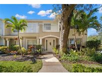 Charming two-story home with a walkway, landscaped yard and balcony, perfect for enjoying the outdoors at 280 Dr Ml King Jr N St, Safety Harbor, FL 34695