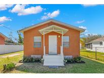 Charming single-story home with a well-manicured lawn and inviting front porch at 6103 Anna Ave, Gibsonton, FL 33534