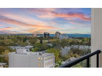 Expansive city views with a colorful sunset from a balcony overlooking the neighborhood and nearby ocean at 226 5Th N Ave # 901, St Petersburg, FL 33701