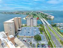 Aerial shot of condo building near the coast with a parking lot and a waterfront view at 5220 Brittany S Dr # 1409, St Petersburg, FL 33715
