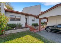Charming single-story home with attached carport and well-maintained landscaping at 7623 Radcliffe Cir # A101, Port Richey, FL 34668