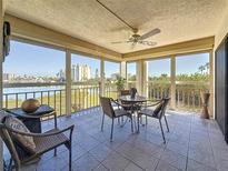 Enjoy the beautiful views from this screened lanai with a tile floor and ceiling fan at 7867 Sailboat Key Blvd S # 201, South Pasadena, FL 33707