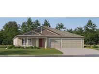 Charming single-story home featuring a two-car garage and a well-manicured lawn at 11861 Blue Diamond Trl, Parrish, FL 34219